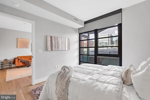 bedroom featuring hardwood / wood-style floors