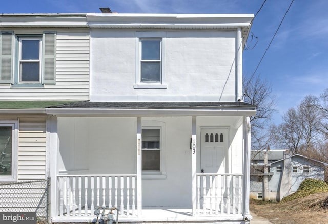 view of property with a porch