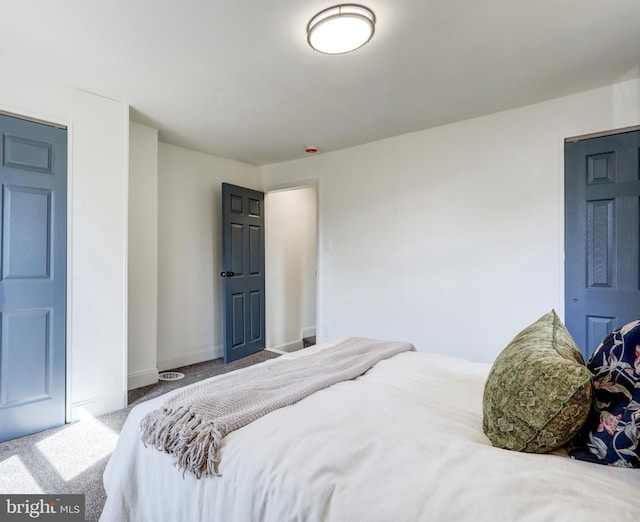 carpeted bedroom with baseboards