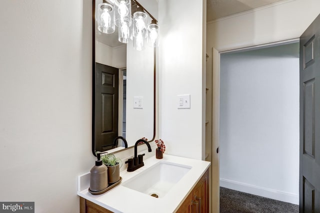 bathroom with vanity and baseboards