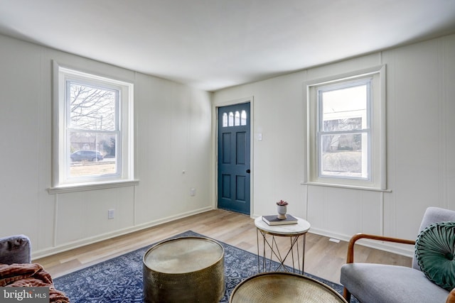 interior space featuring wood finished floors and a decorative wall