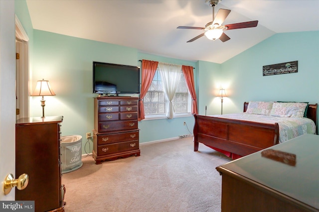 bedroom featuring ceiling fan, lofted ceiling, and light carpet