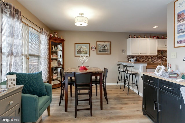 dining room with light wood-type flooring