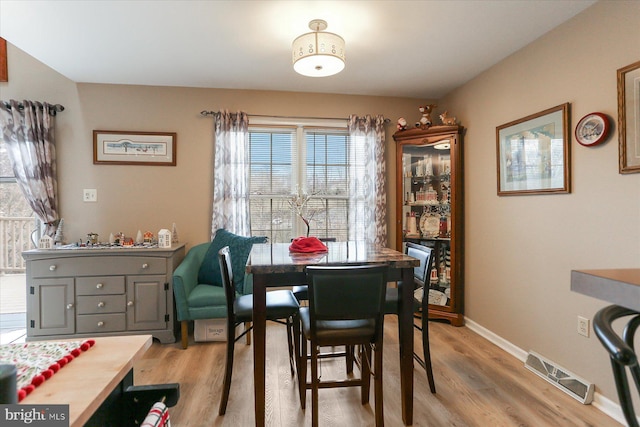 dining room with hardwood / wood-style floors