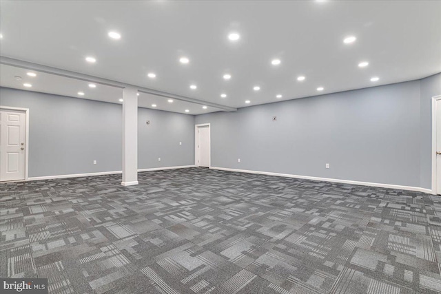 basement featuring dark colored carpet