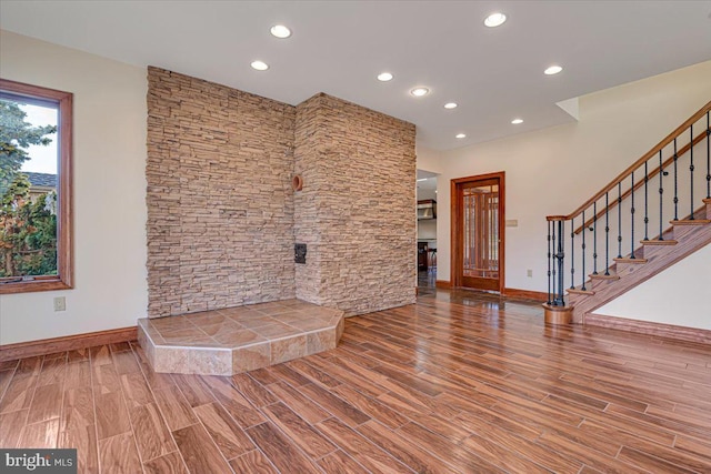 unfurnished living room with hardwood / wood-style floors