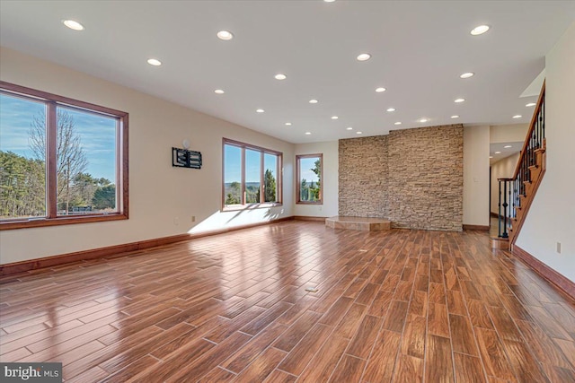 unfurnished living room featuring a wealth of natural light