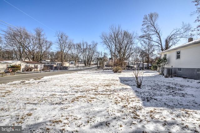 view of yard layered in snow