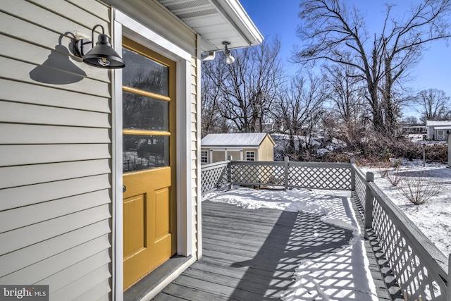 view of snow covered deck