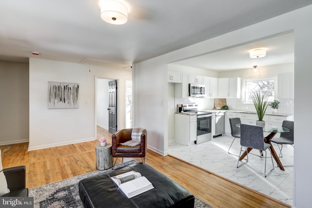 living room with light hardwood / wood-style floors