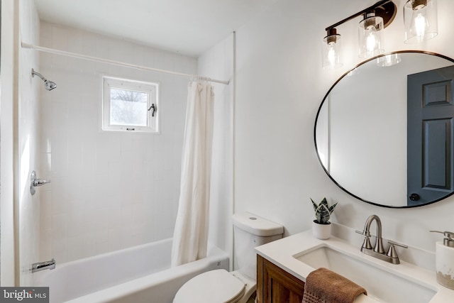 full bathroom with vanity, shower / bath combo, and toilet