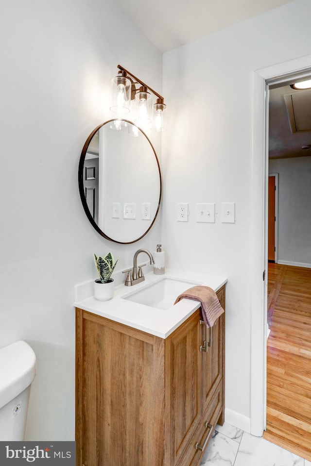 bathroom with vanity and toilet