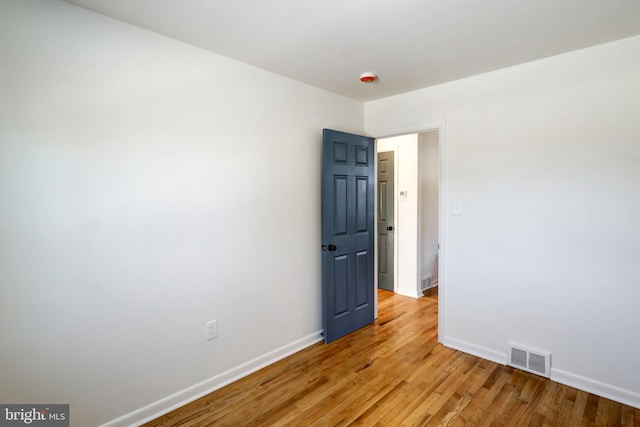 spare room featuring light hardwood / wood-style floors