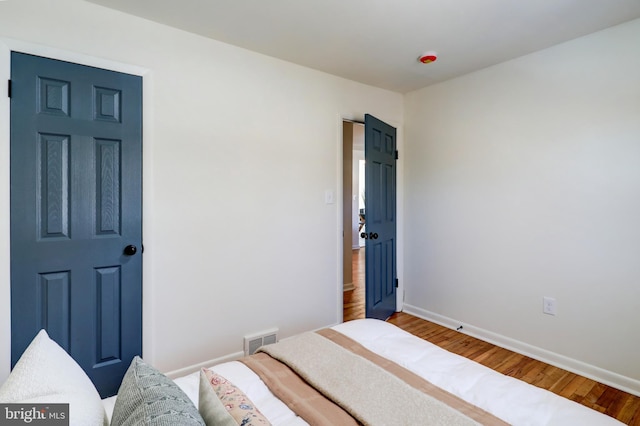 bedroom featuring hardwood / wood-style flooring