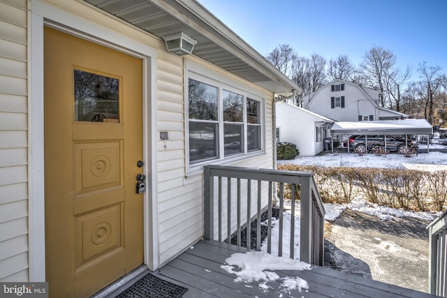 view of snow covered property entrance