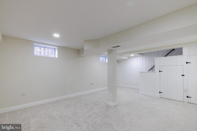 basement with light colored carpet