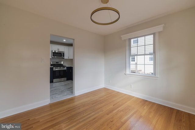 empty room featuring light wood-type flooring