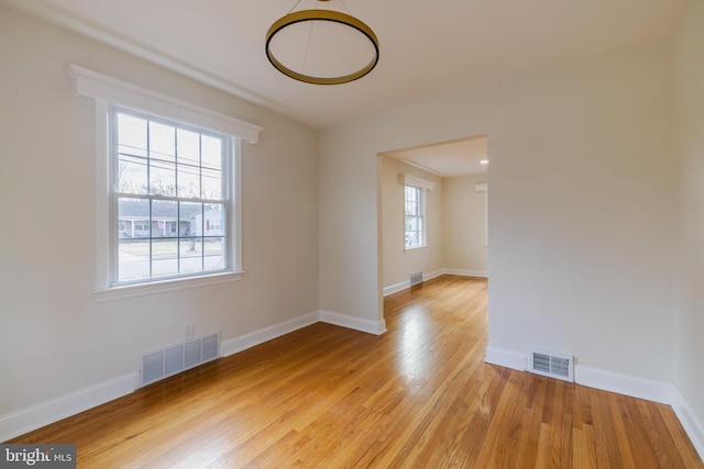 spare room featuring light hardwood / wood-style flooring