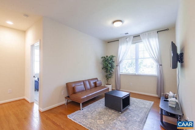 sitting room with hardwood / wood-style floors