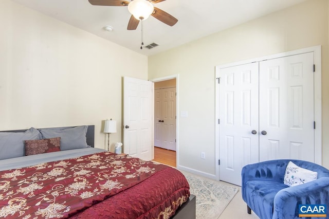 bedroom featuring ceiling fan and a closet