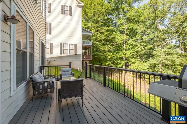 wooden deck featuring outdoor lounge area