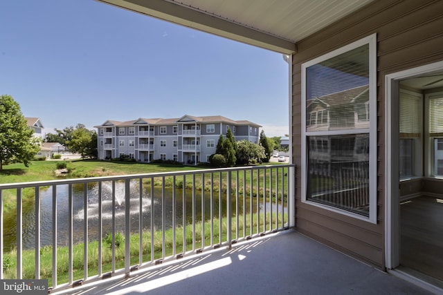 balcony featuring a water view