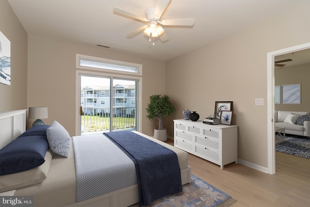 bedroom with ceiling fan, access to exterior, and light hardwood / wood-style flooring