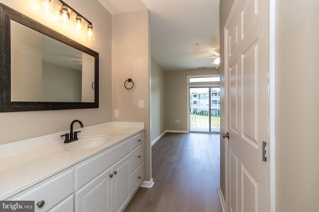 bathroom featuring vanity, hardwood / wood-style flooring, and ceiling fan