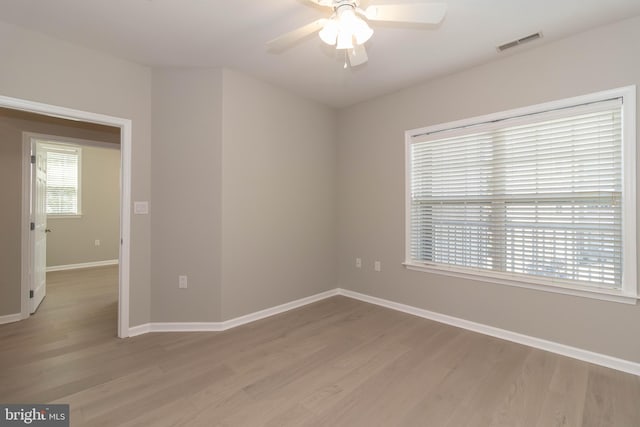 unfurnished room with light hardwood / wood-style flooring and ceiling fan