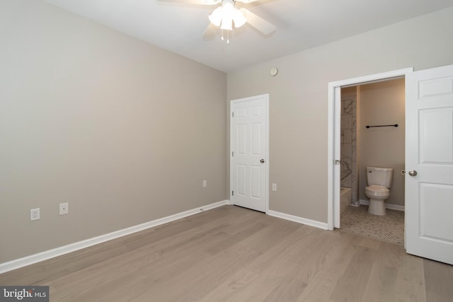 unfurnished bedroom featuring connected bathroom, ceiling fan, and light hardwood / wood-style flooring