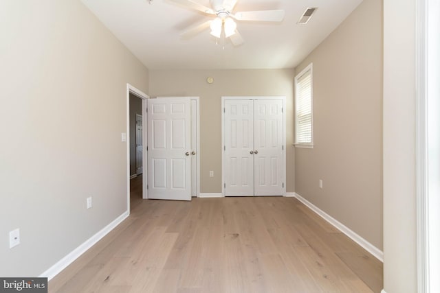 unfurnished bedroom featuring ceiling fan and light wood-type flooring