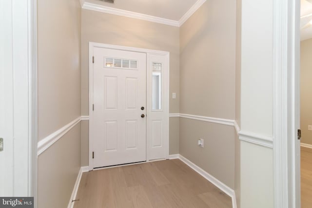 entryway featuring crown molding and light hardwood / wood-style flooring