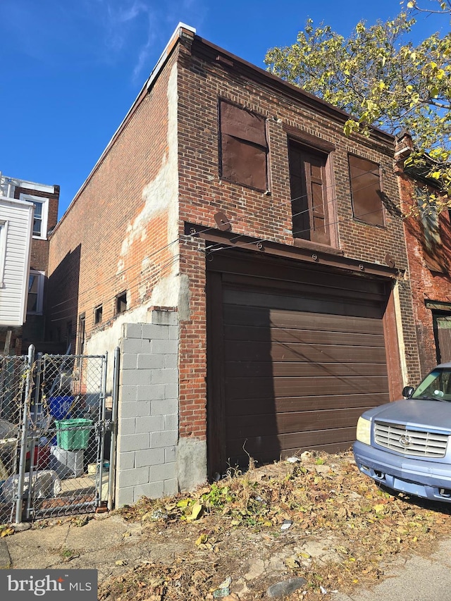 view of side of home with a garage