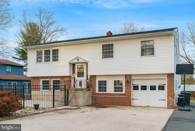 bi-level home featuring a garage