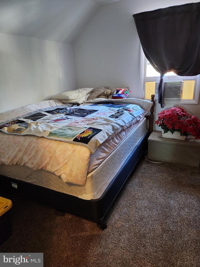 bedroom featuring carpet floors, vaulted ceiling, and cooling unit