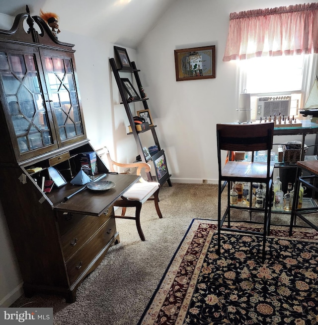 office space with carpet and vaulted ceiling