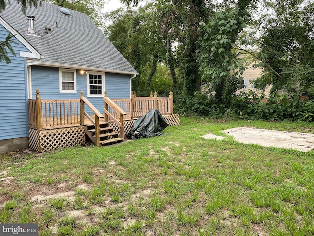 view of yard featuring a deck