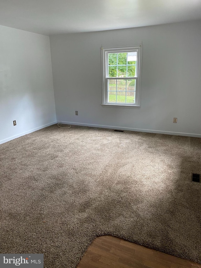 spare room featuring hardwood / wood-style flooring