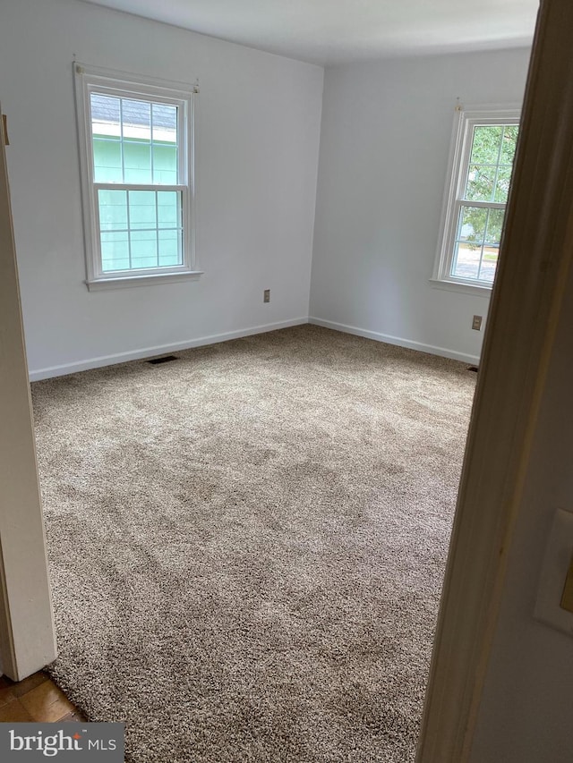 unfurnished room with carpet