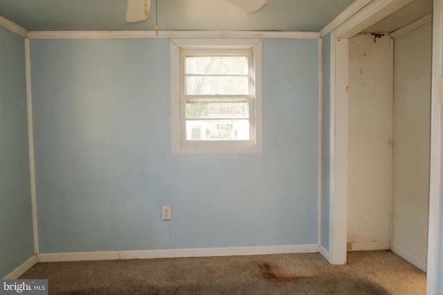 unfurnished room with light colored carpet and ornamental molding