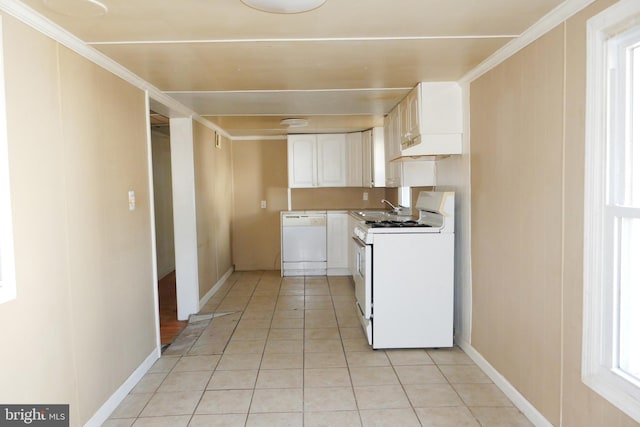 kitchen with ornamental molding, white appliances, sink, light tile patterned floors, and white cabinets