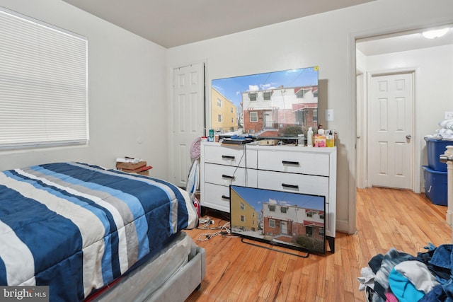 bedroom with light hardwood / wood-style flooring