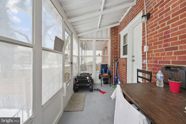 sunroom / solarium with lofted ceiling