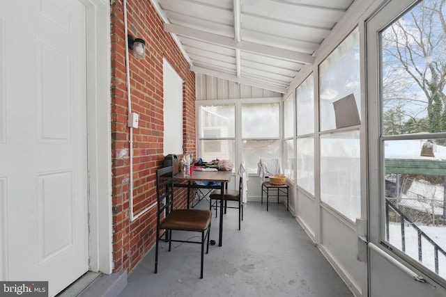 sunroom with lofted ceiling