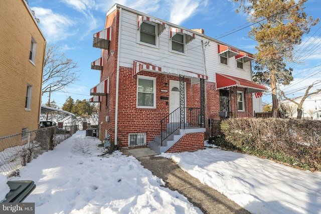 view of front of home with central air condition unit