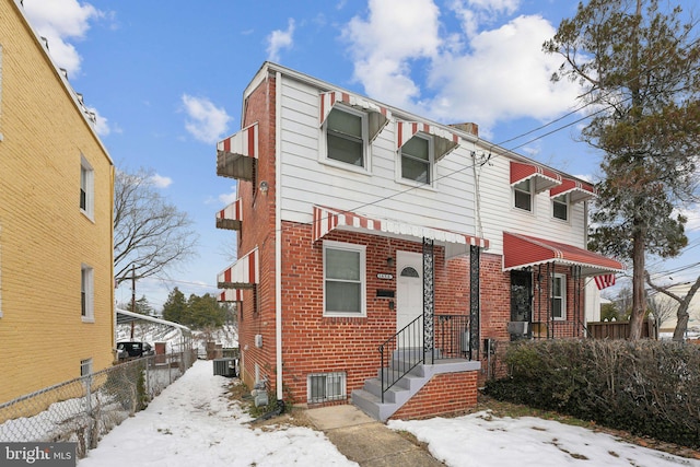 view of front of property featuring cooling unit