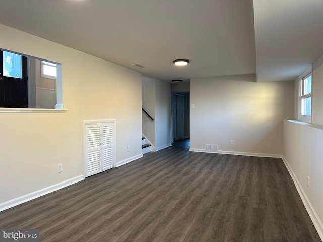 empty room featuring dark hardwood / wood-style flooring