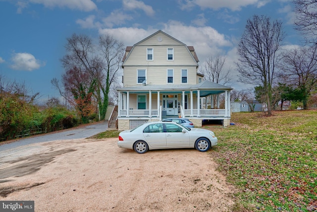 view of front of home featuring a porch and a front yard