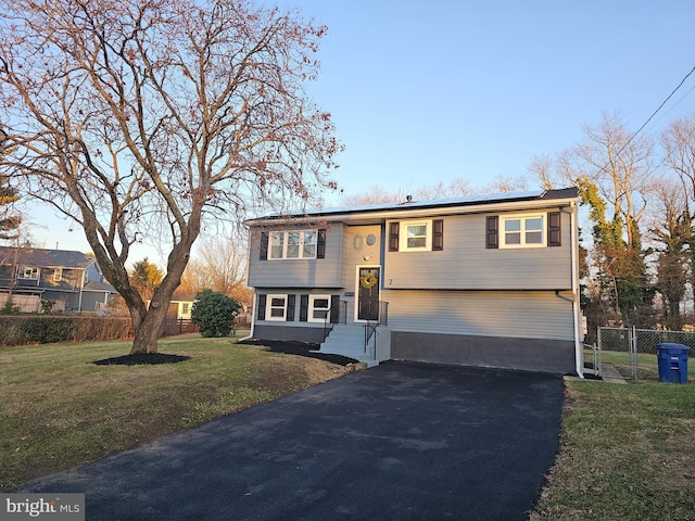 bi-level home with a front yard