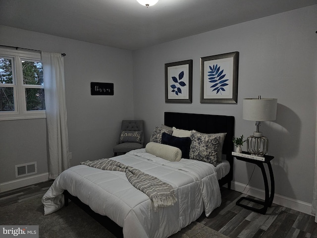 bedroom featuring dark hardwood / wood-style floors